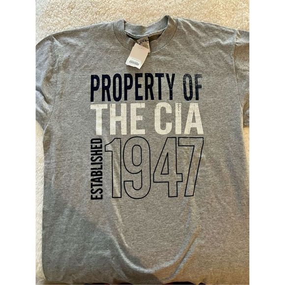 Property Of The CIA Other - Property Of The CIA Established 1947 - CIA Authentic Employee Activity XL. 
Reta
